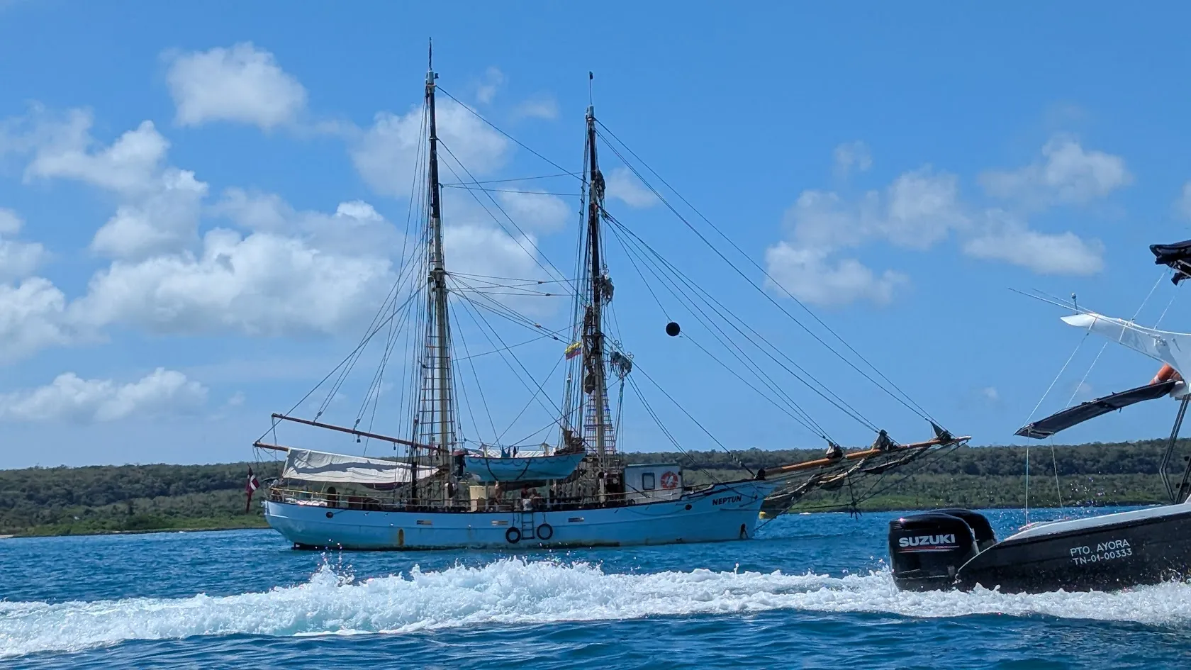 NEPTUN at anchor in Academy Bay, Puerto Ayora, with Santa Cruz Island in the background