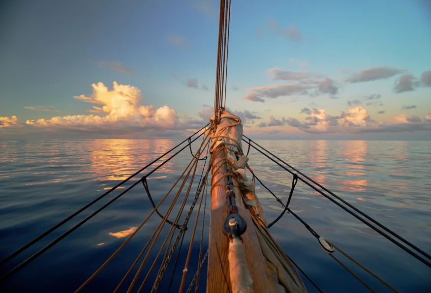 Mirror-calm sea in the ITCZ, typical of the doldrums between trade-wind belts