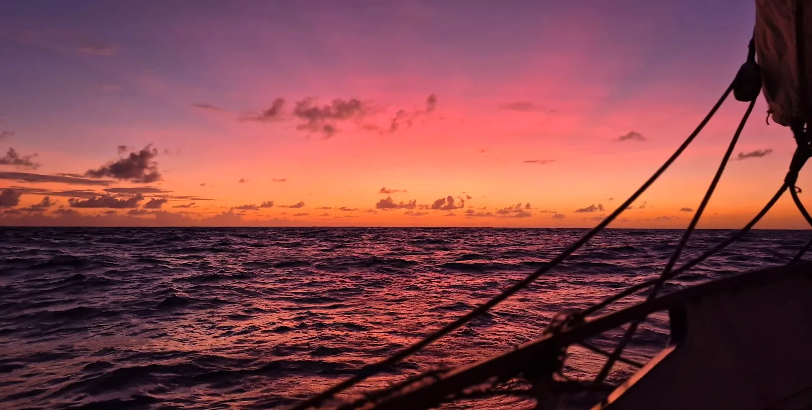 Sunset over Palau's limestone islets with NEPTUN at anchor in the quiet bay