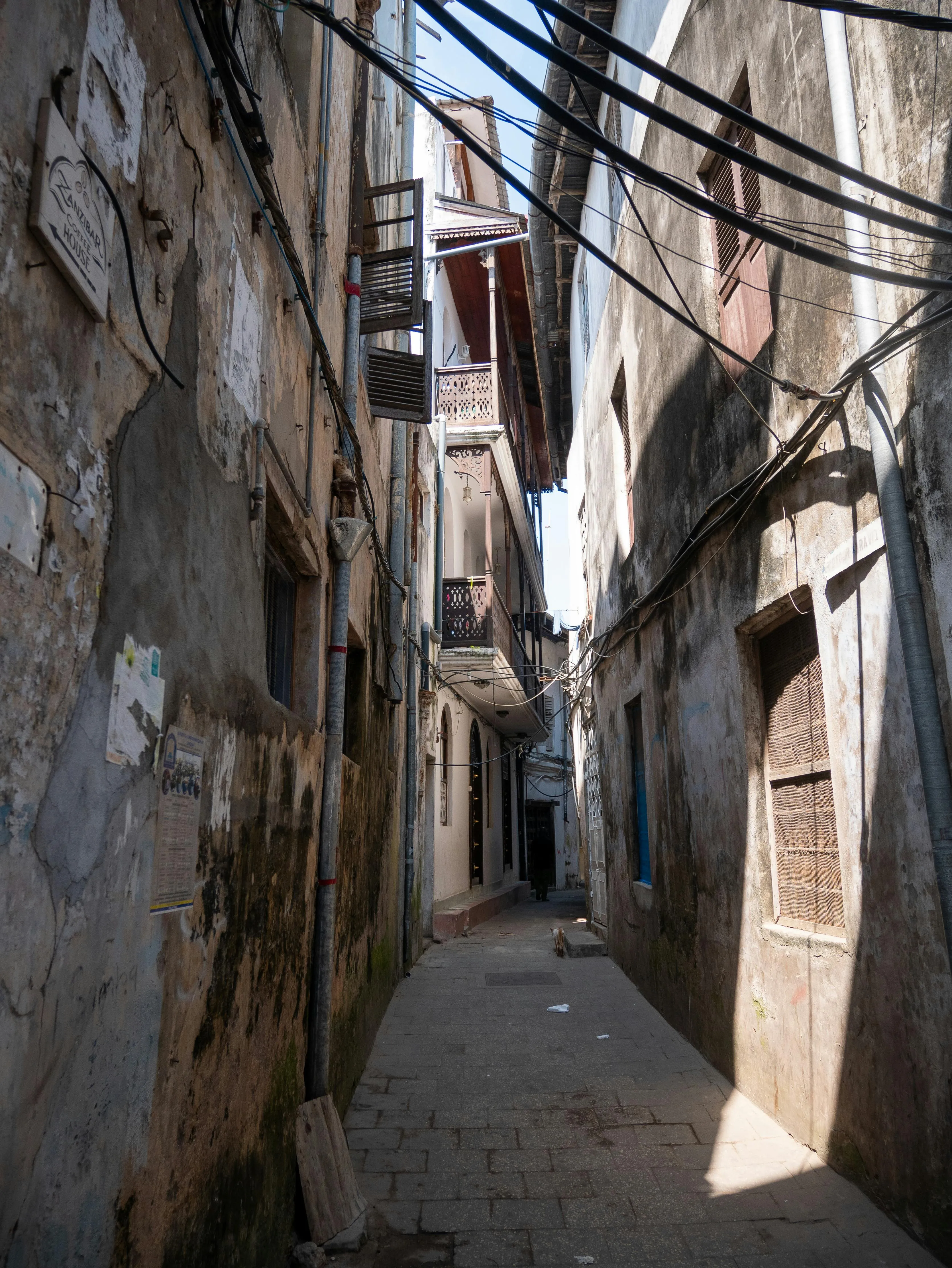 Narrow alley in Stone Town, the coral-rag maze that UNESCO protects.