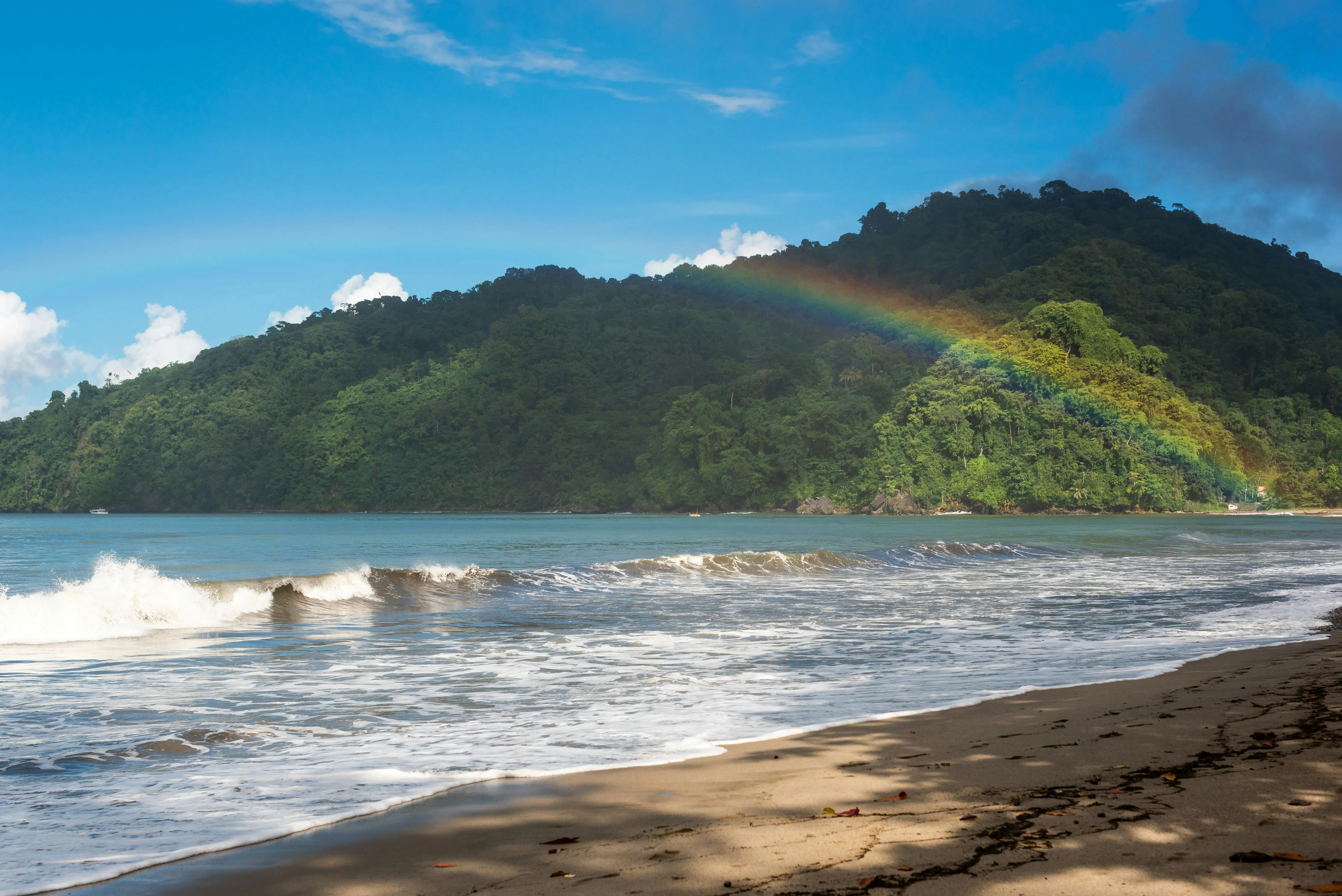 A rainbow over the Trinidad coast, the starting weather of Leg 7 after eight days in the yard.