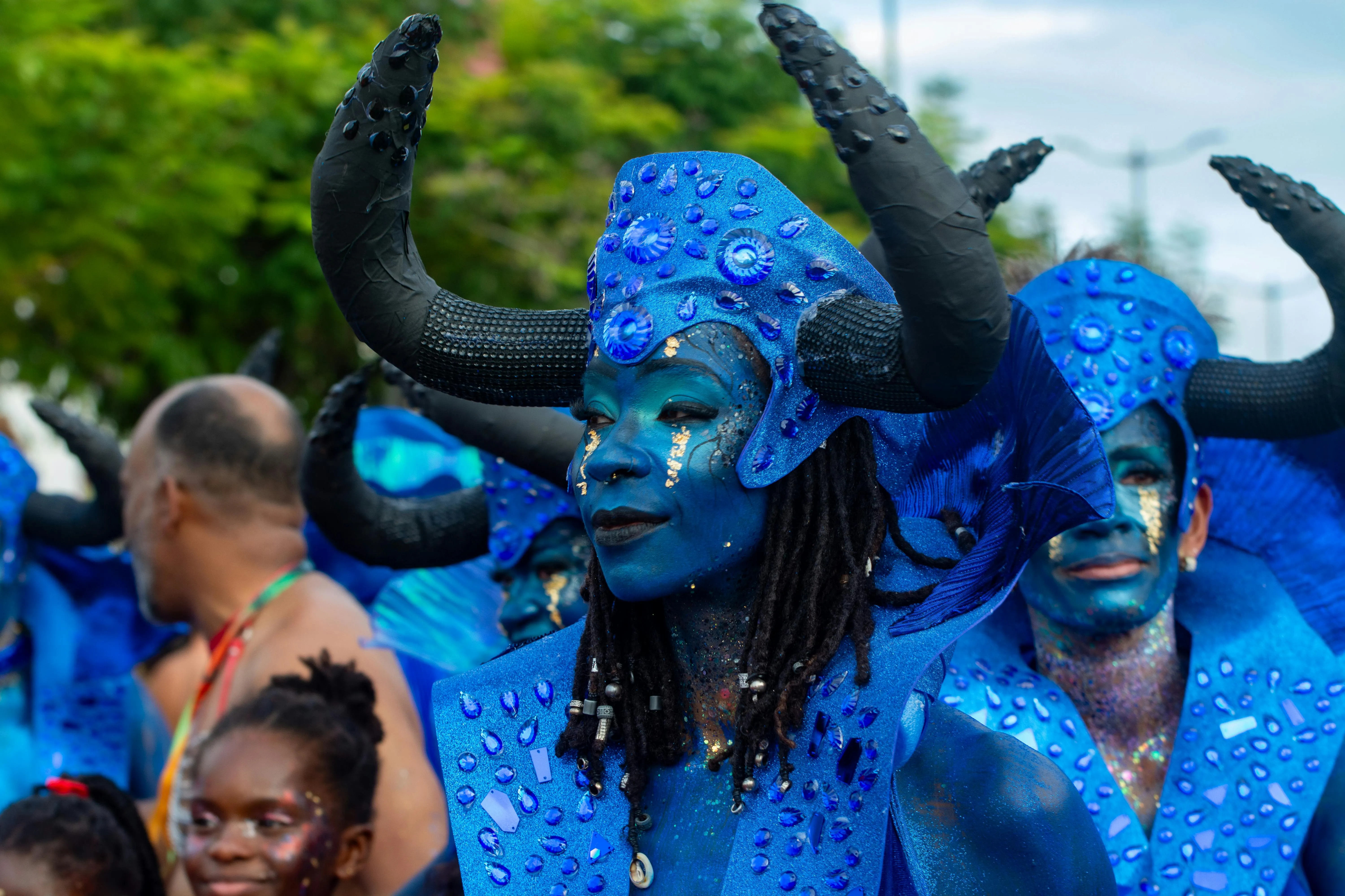 Carnival feathers, colour and noise, the rhythm the crew walks into after twenty days at sea.