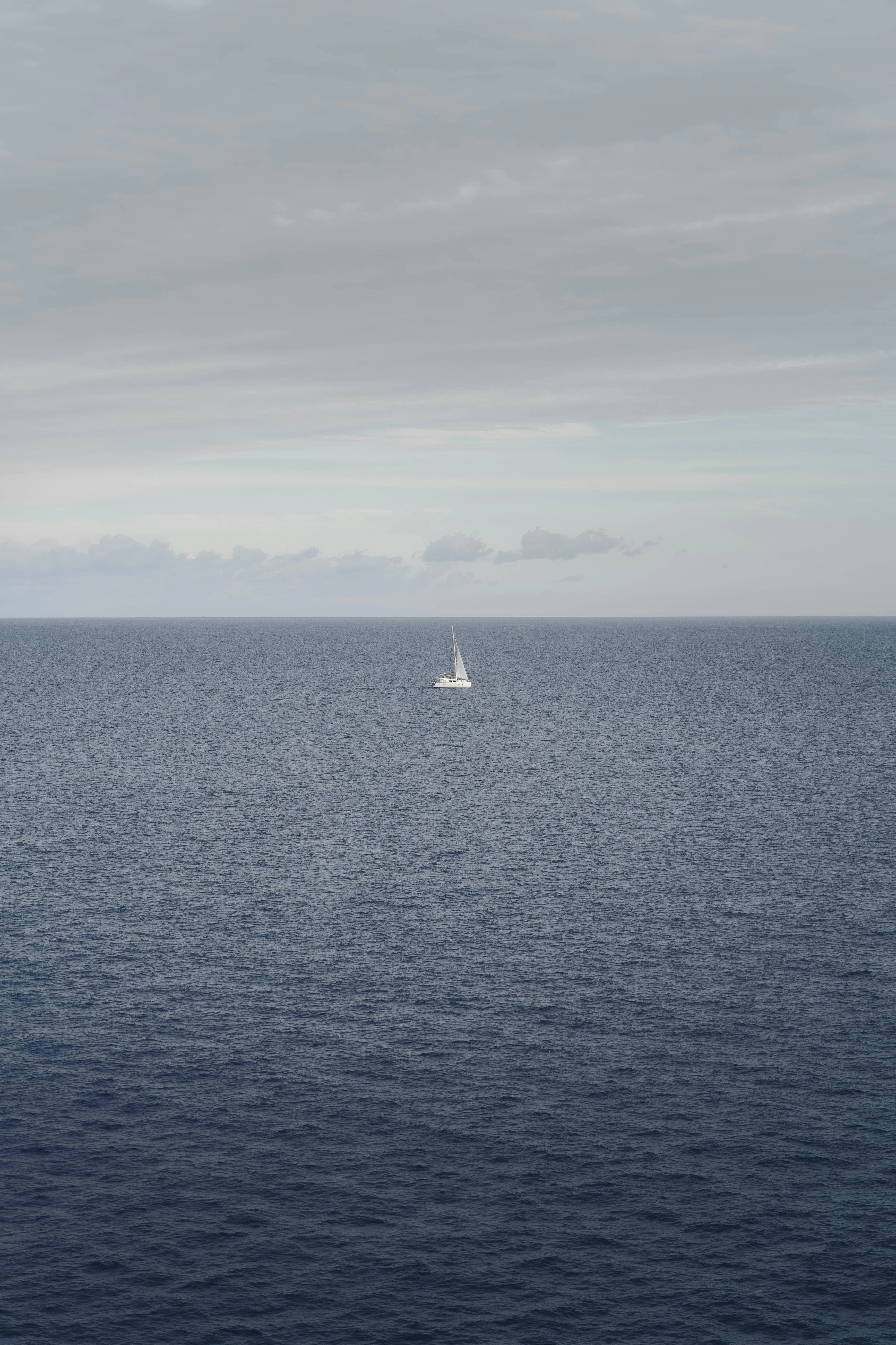 A solitary sail under a moody North Atlantic sky, the long reach between Bermuda and the Azores.