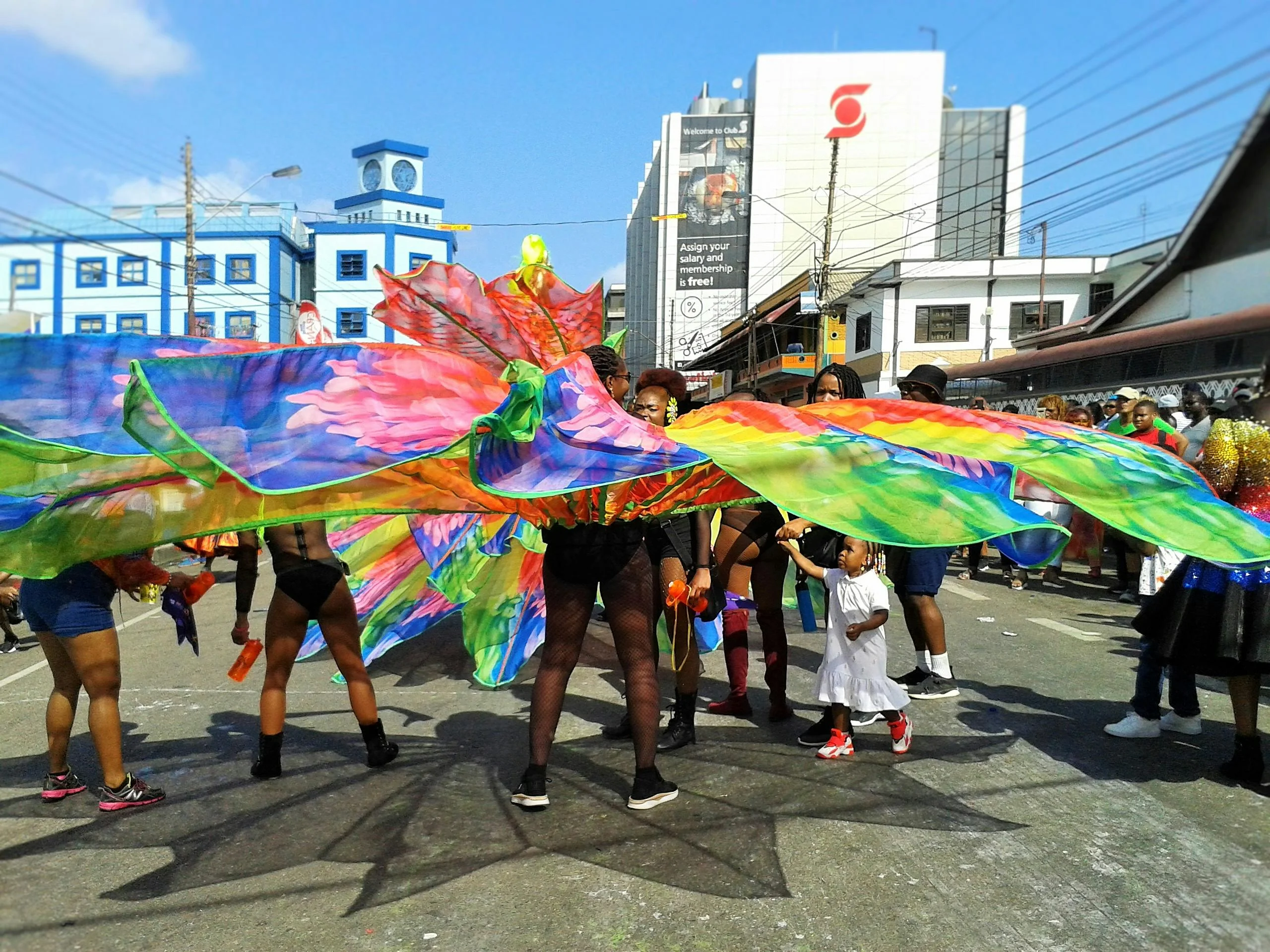 Carnival in the streets of Trinidad, the loudest, most richly cultural landfall of the voyage.