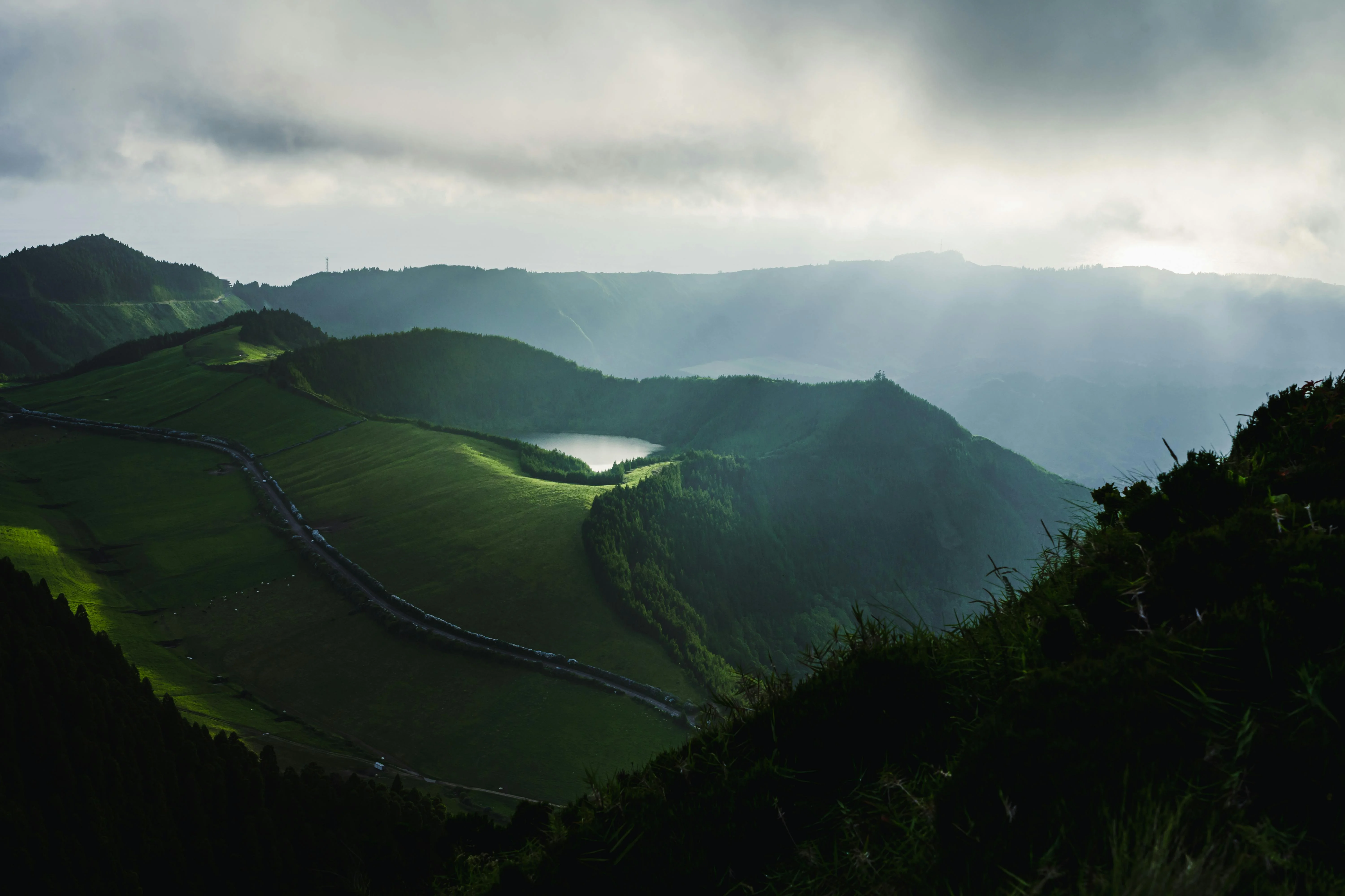 A crater lake in the Azores, volcanic calderas filled with rainwater, the signature landscape of São Miguel.
